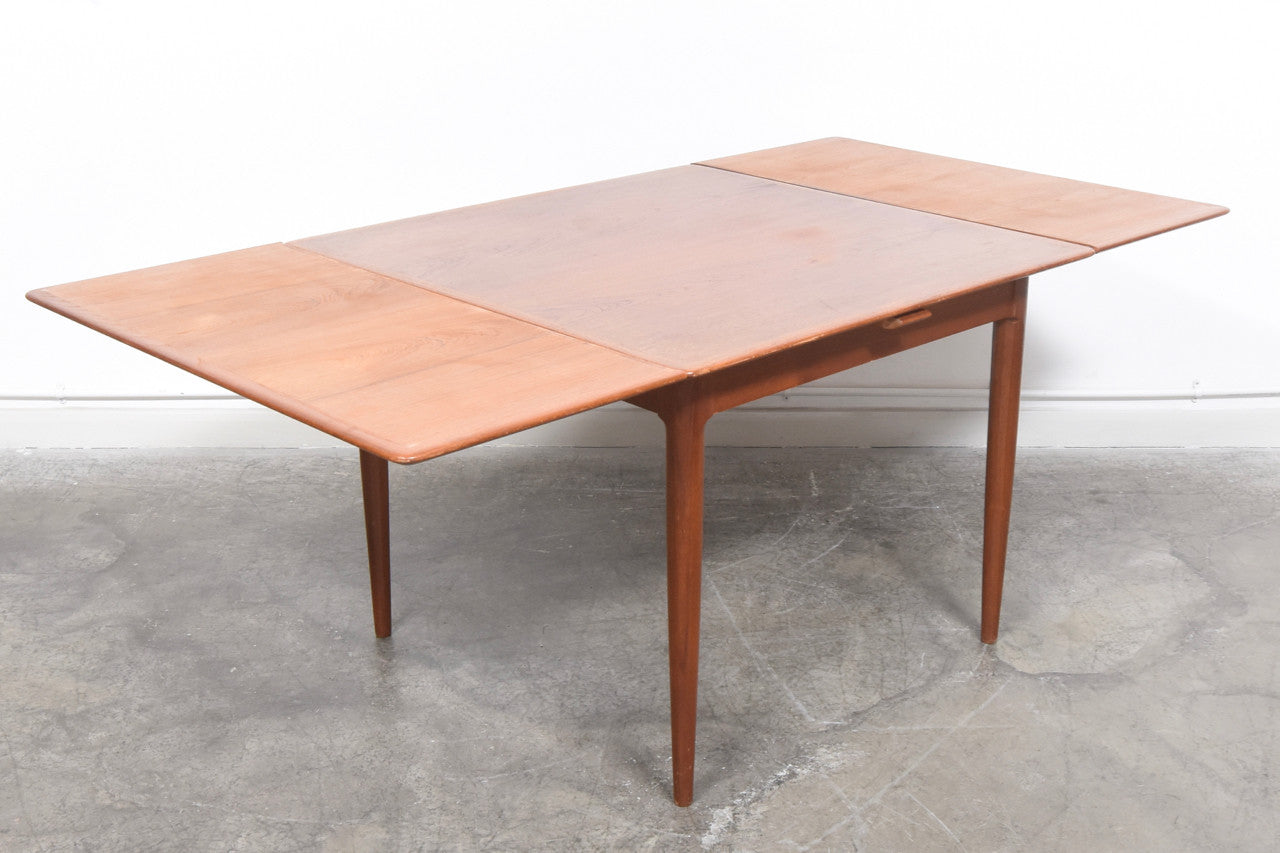 Extending square dining table in teak