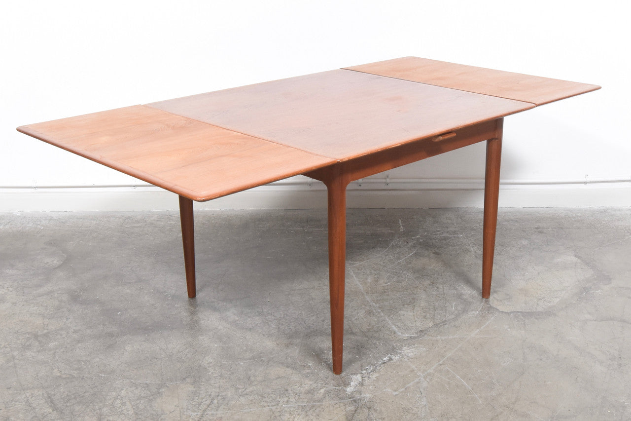 Extending square dining table in teak