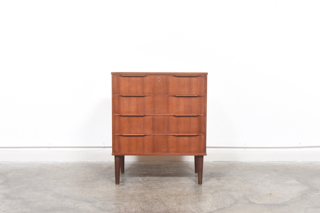 Chest of four drawers with lipped handles