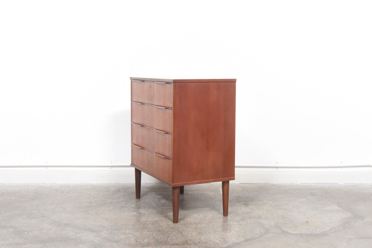 Chest of four drawers with lipped handles