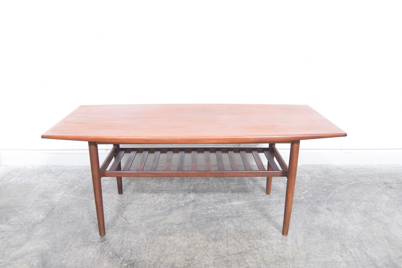 Teak coffee table with slatted magazine shelf