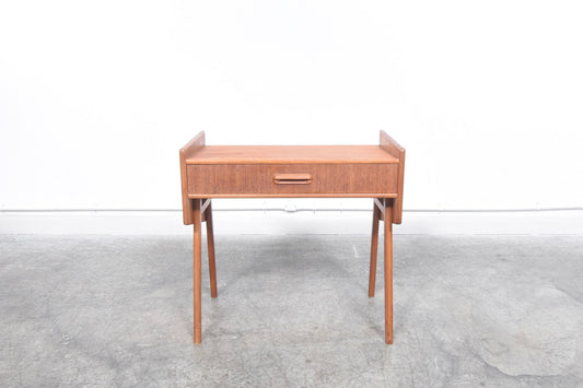 Angular teak side table with drawer
