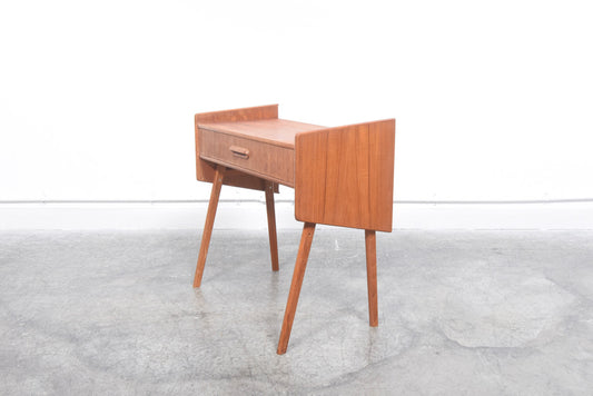 Angular teak side table with drawer