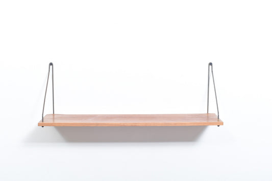 Floating shelf in teak with brass supports