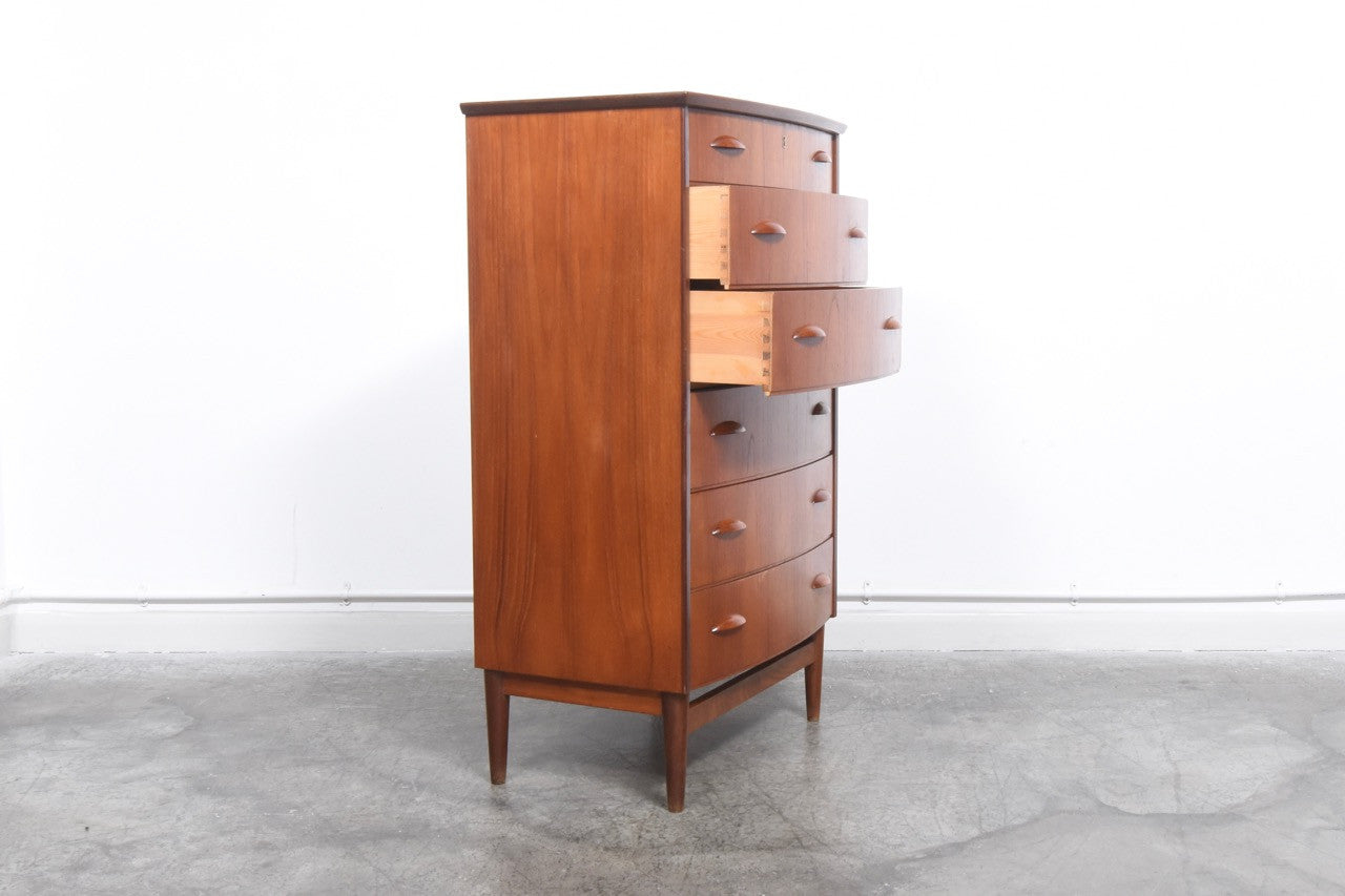 Bow-fronted teak chest of drawers