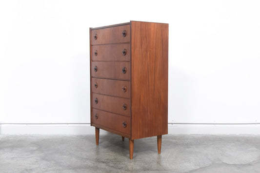 Tall teak chest of drawers