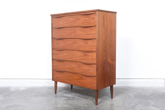 Teak chest of drawers with lipped handles