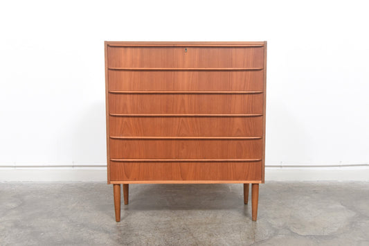 Wide chest of teak drawers