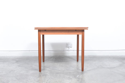 Extending square dining table in teak