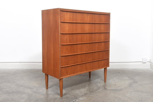 Wide chest of teak drawers