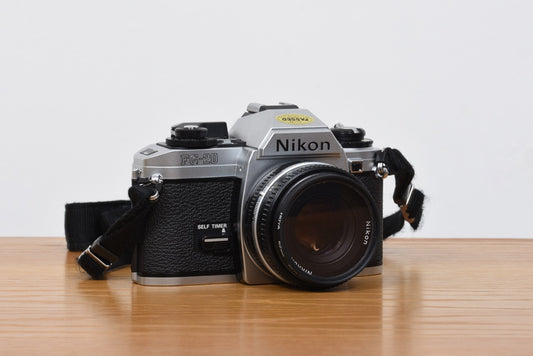 FG-20 SLR camera + lenses by Nikon