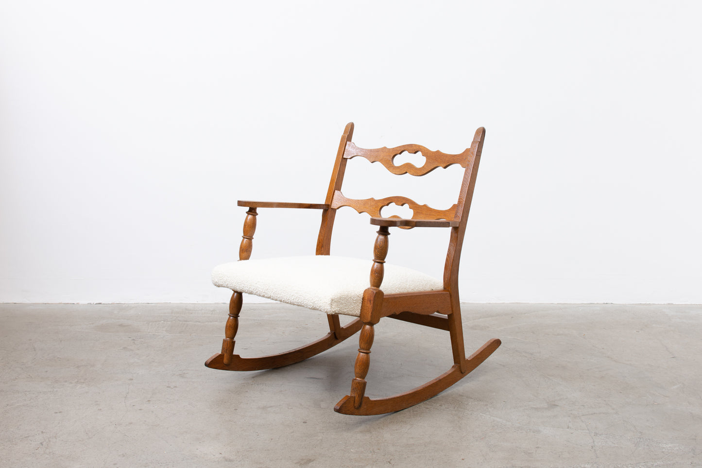 Save £100: Oak and bouclé rocking chair by Henning Kjærnulf