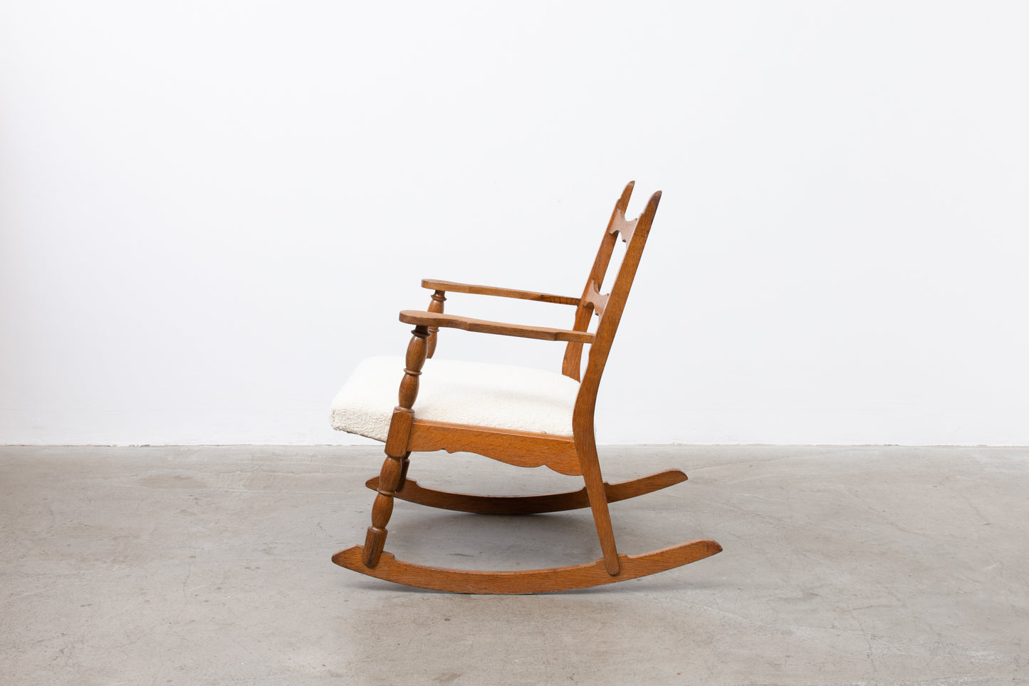 Save £100: Oak and bouclé rocking chair by Henning Kjærnulf