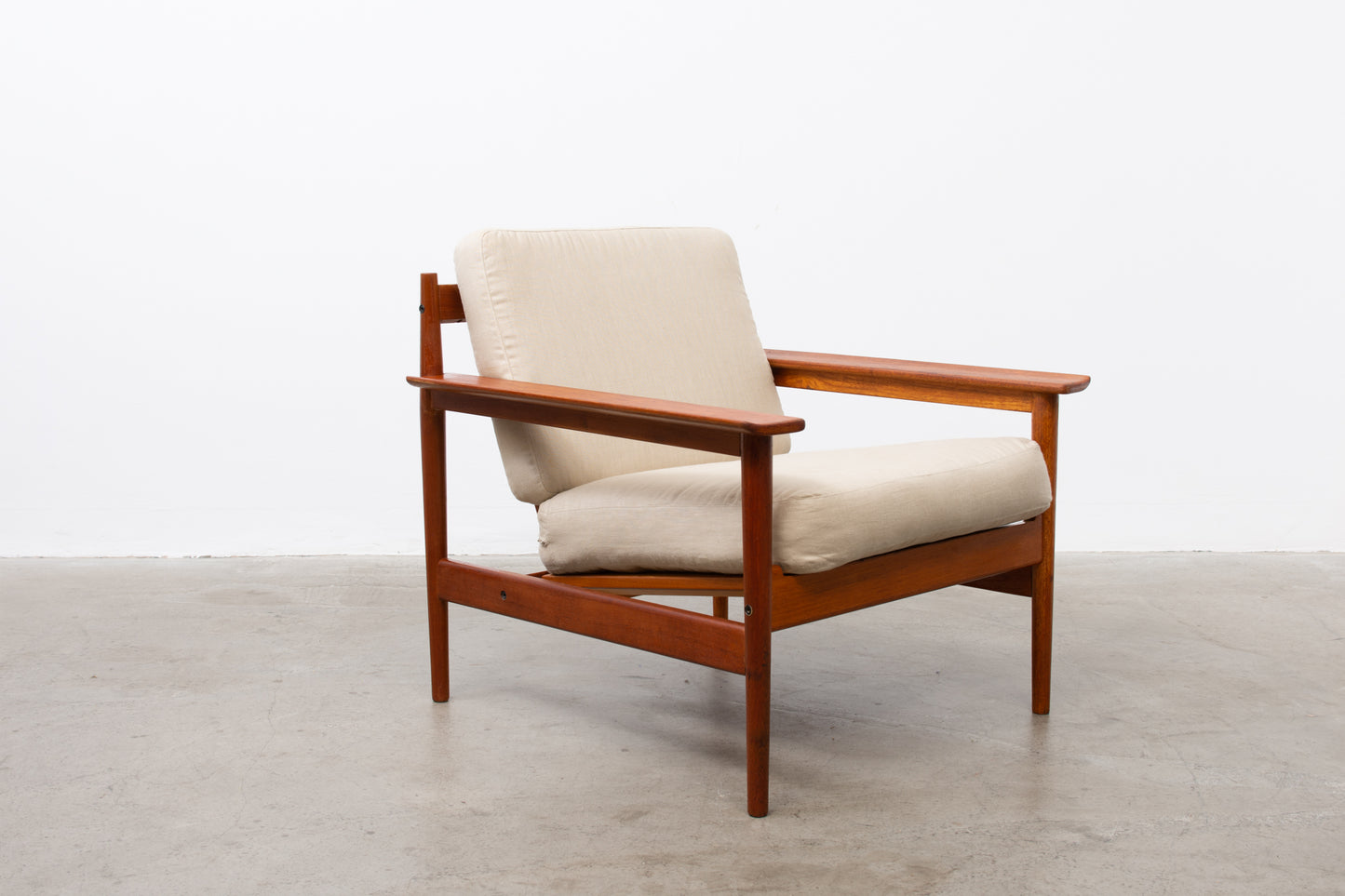 1960s teak lounger with linen cushions
