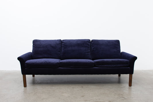 Newly upholstered: 1960s three seater in navy corduroy