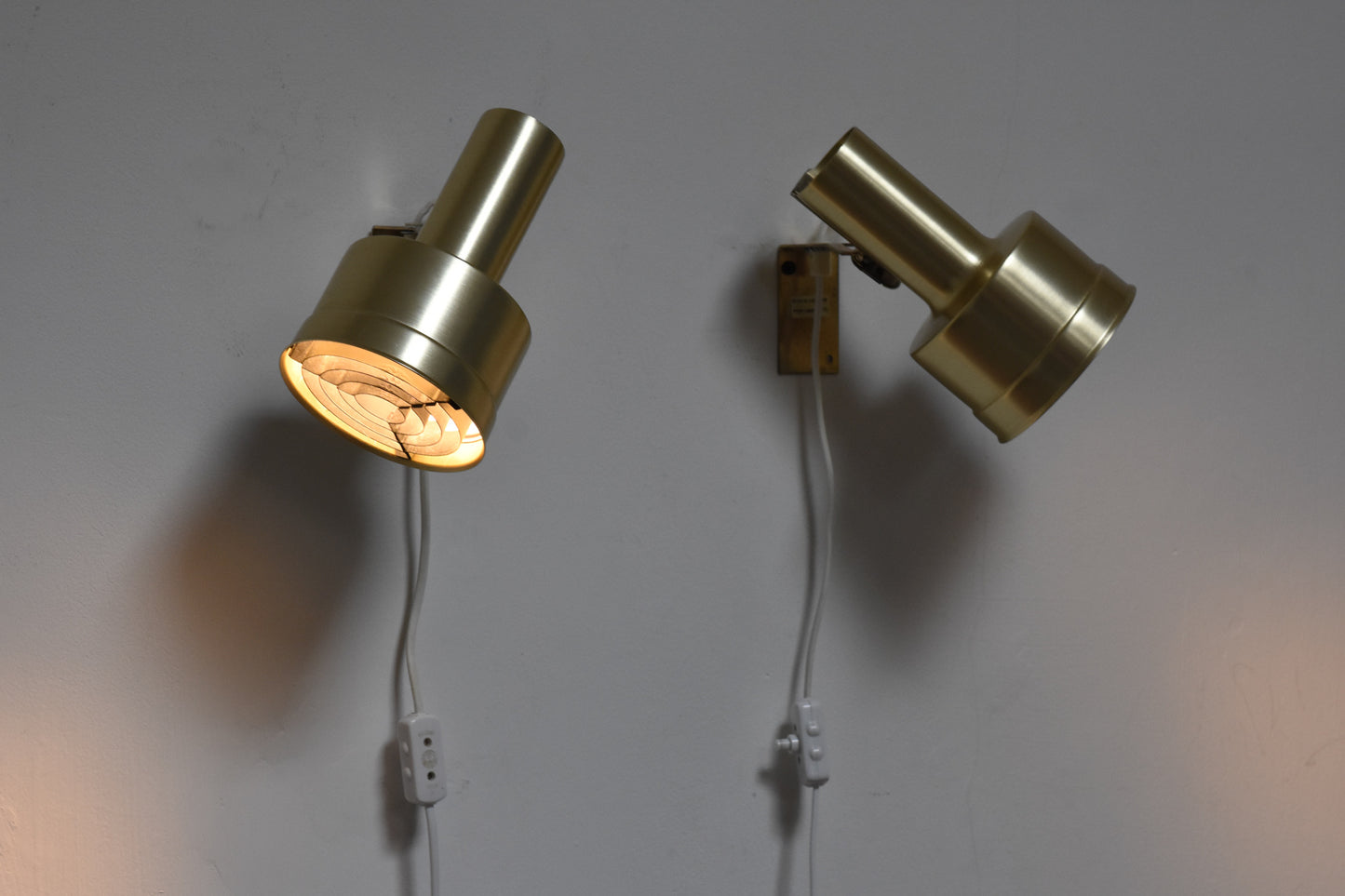 Pair of brass bedside lamps by Kosta Lampan