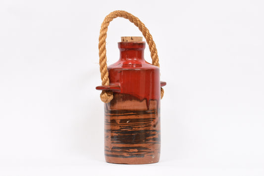 Stoneware jug with cork lid and rope handle