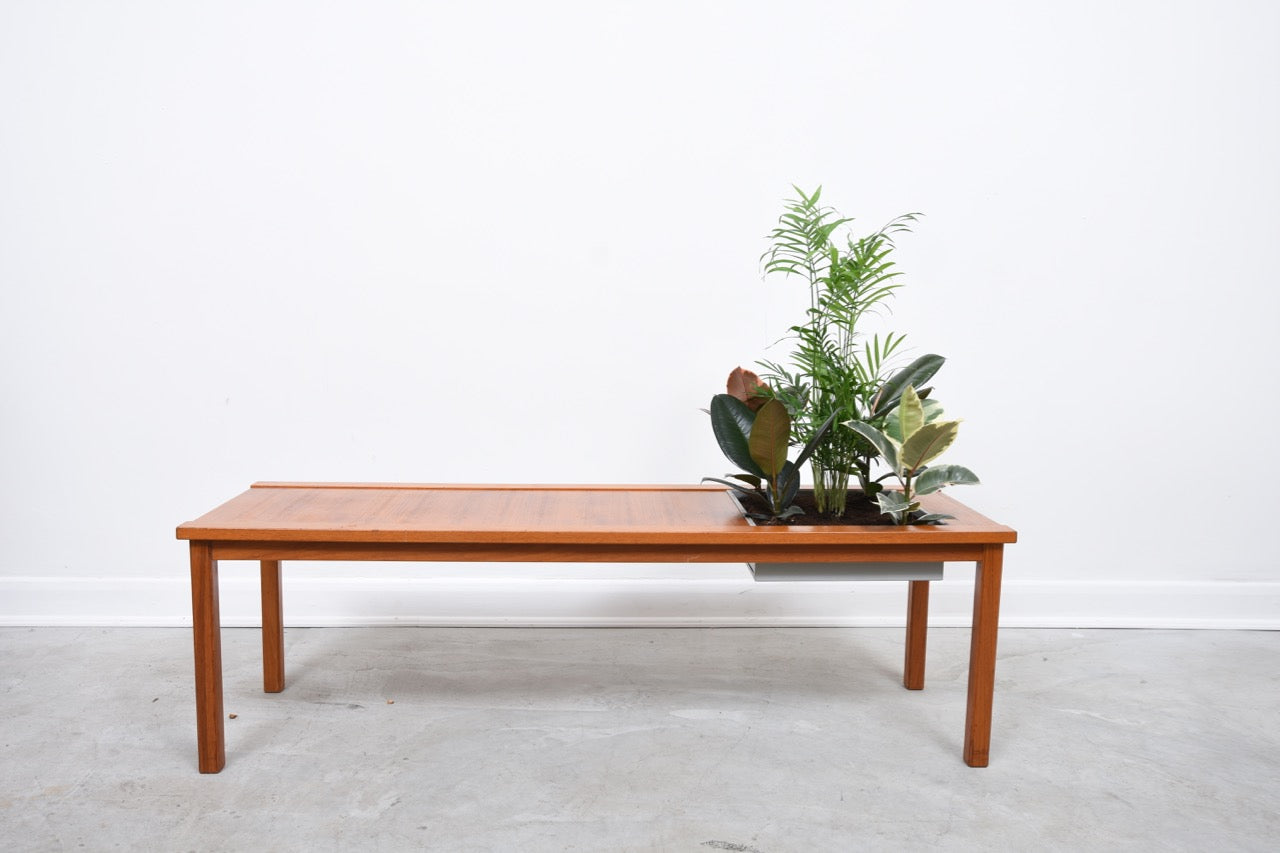 Coffee table with planter