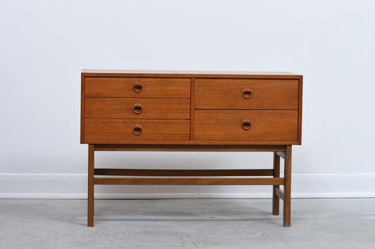 Short chest of five teak drawers