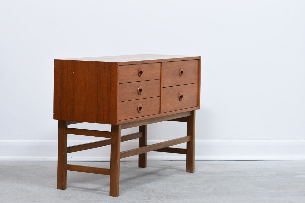 Short chest of five teak drawers