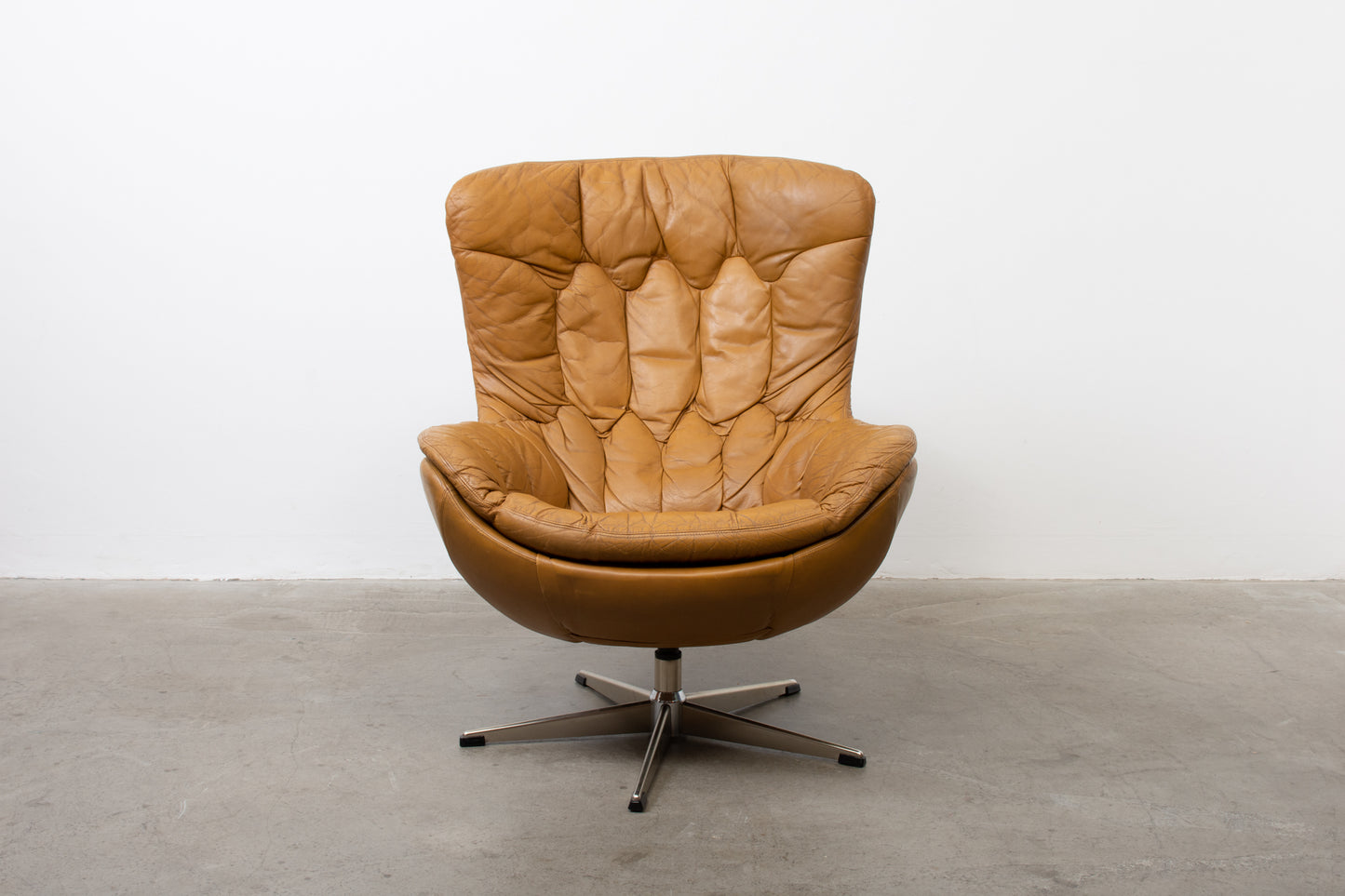 1960s leather swivel chair with foot stool