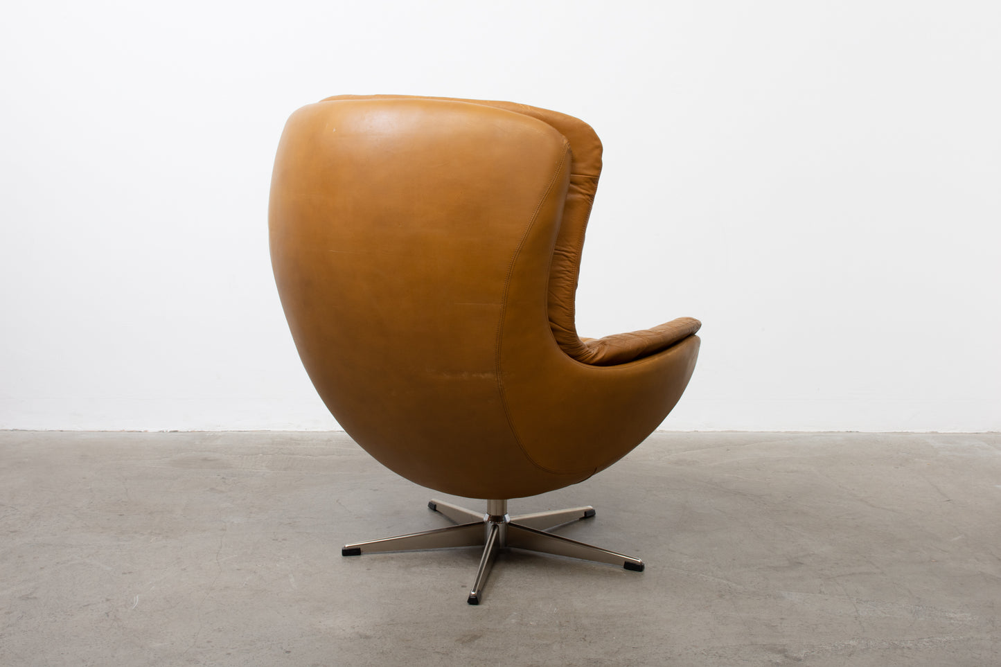 1960s leather swivel chair with foot stool