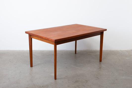 Extending teak dining table by Henning Kjærnulf