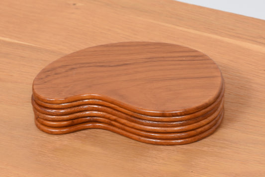 Set of six teak coasters