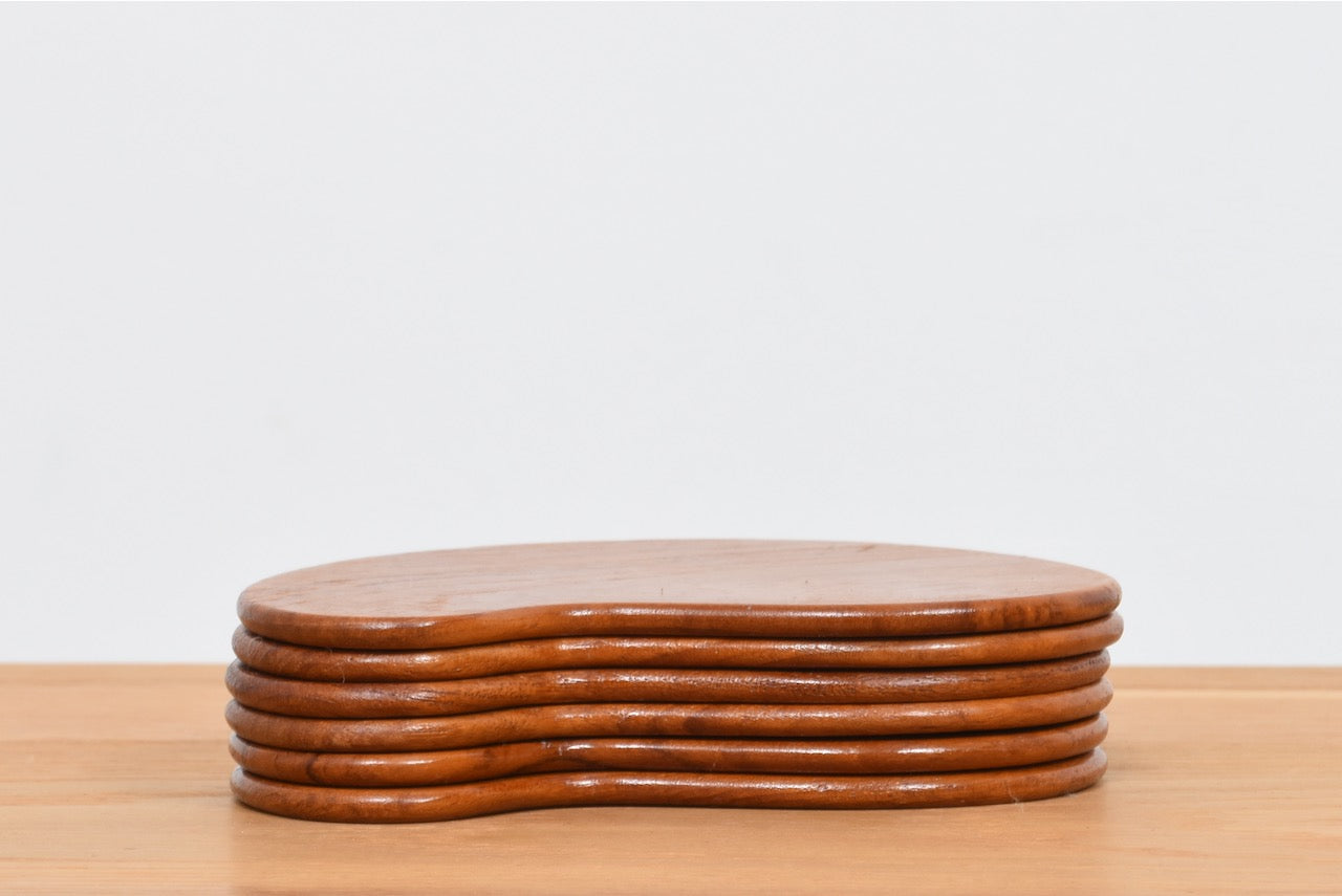 Set of six teak coasters