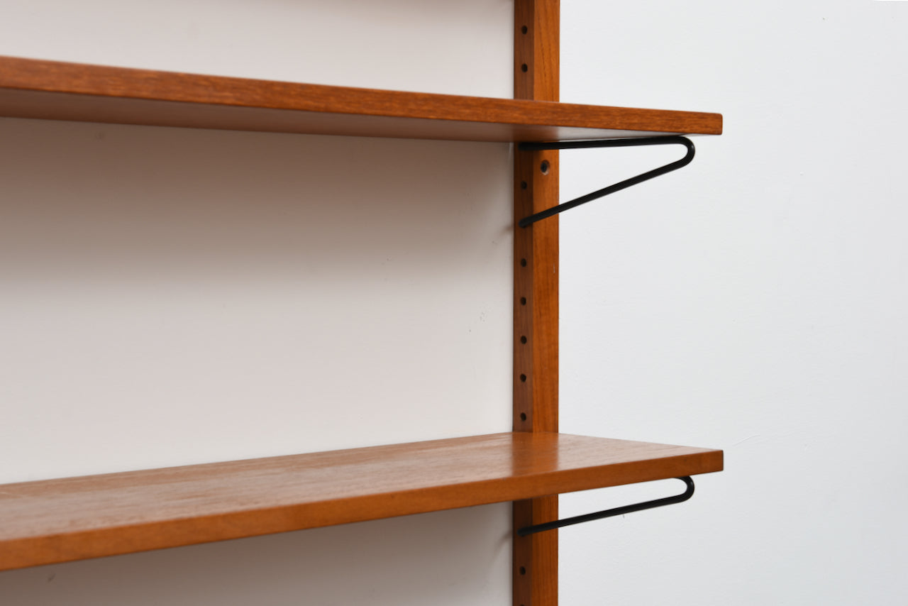 Single bay of teak shelves