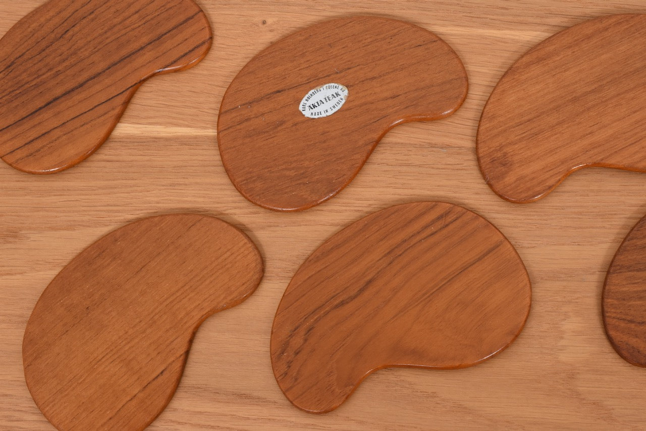 Set of six teak coasters