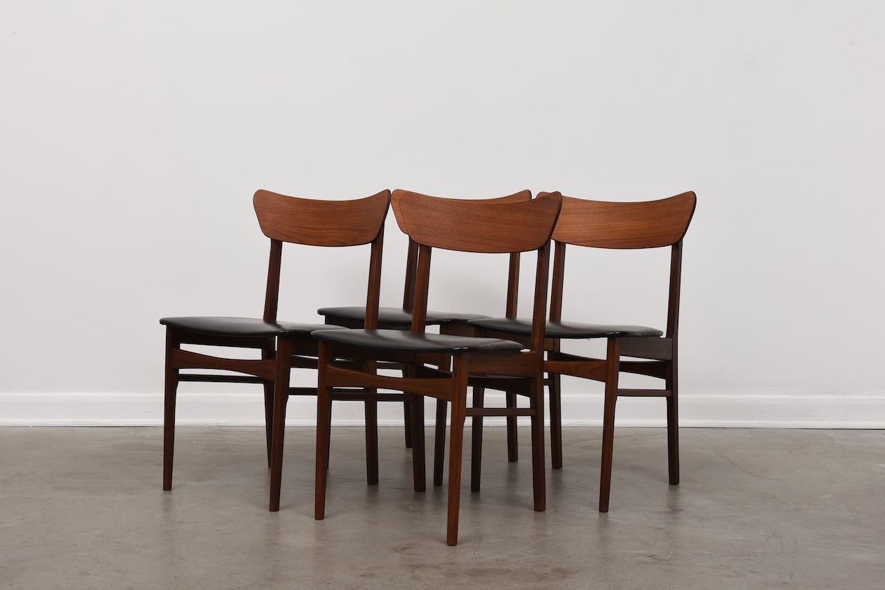 Set of four teak + vinyl dining chairs