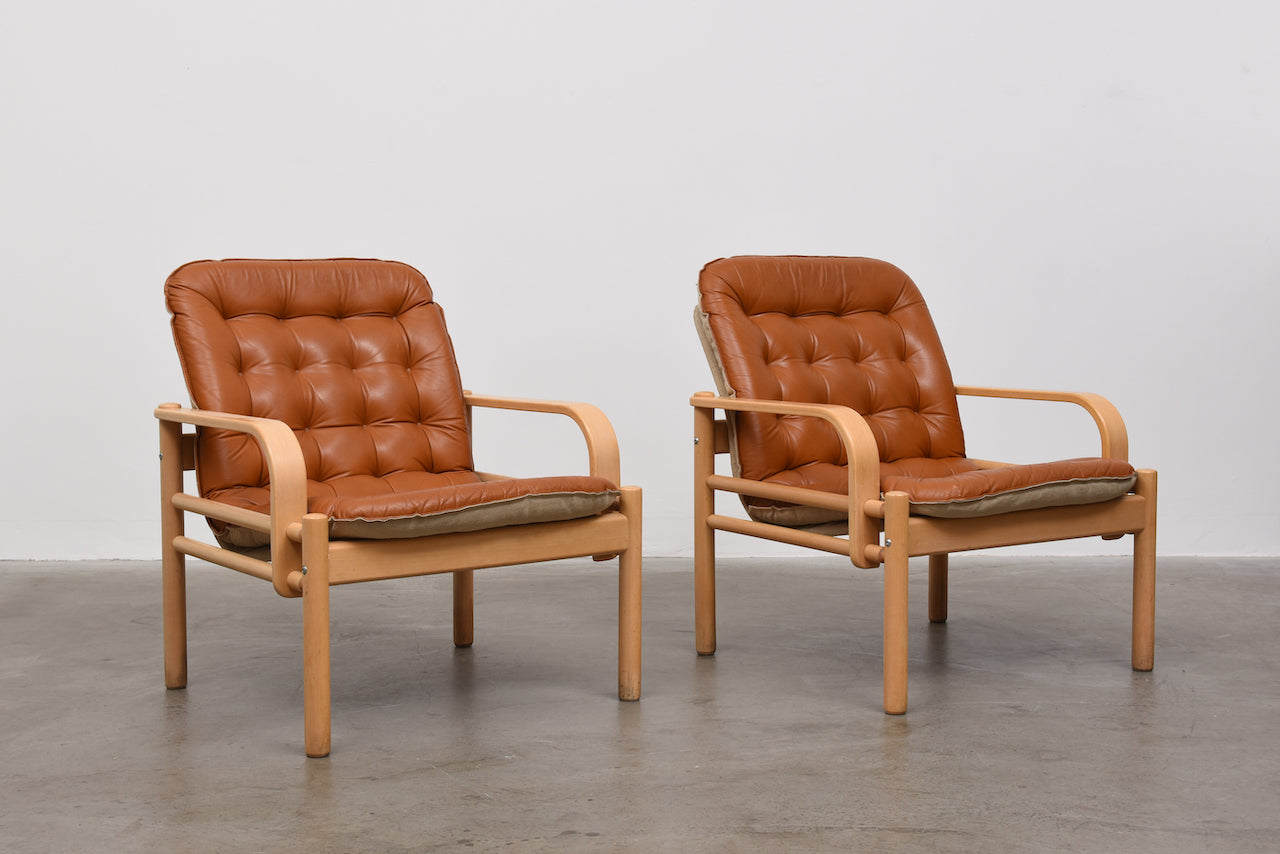 Two available: 1980s leather and beech loungers