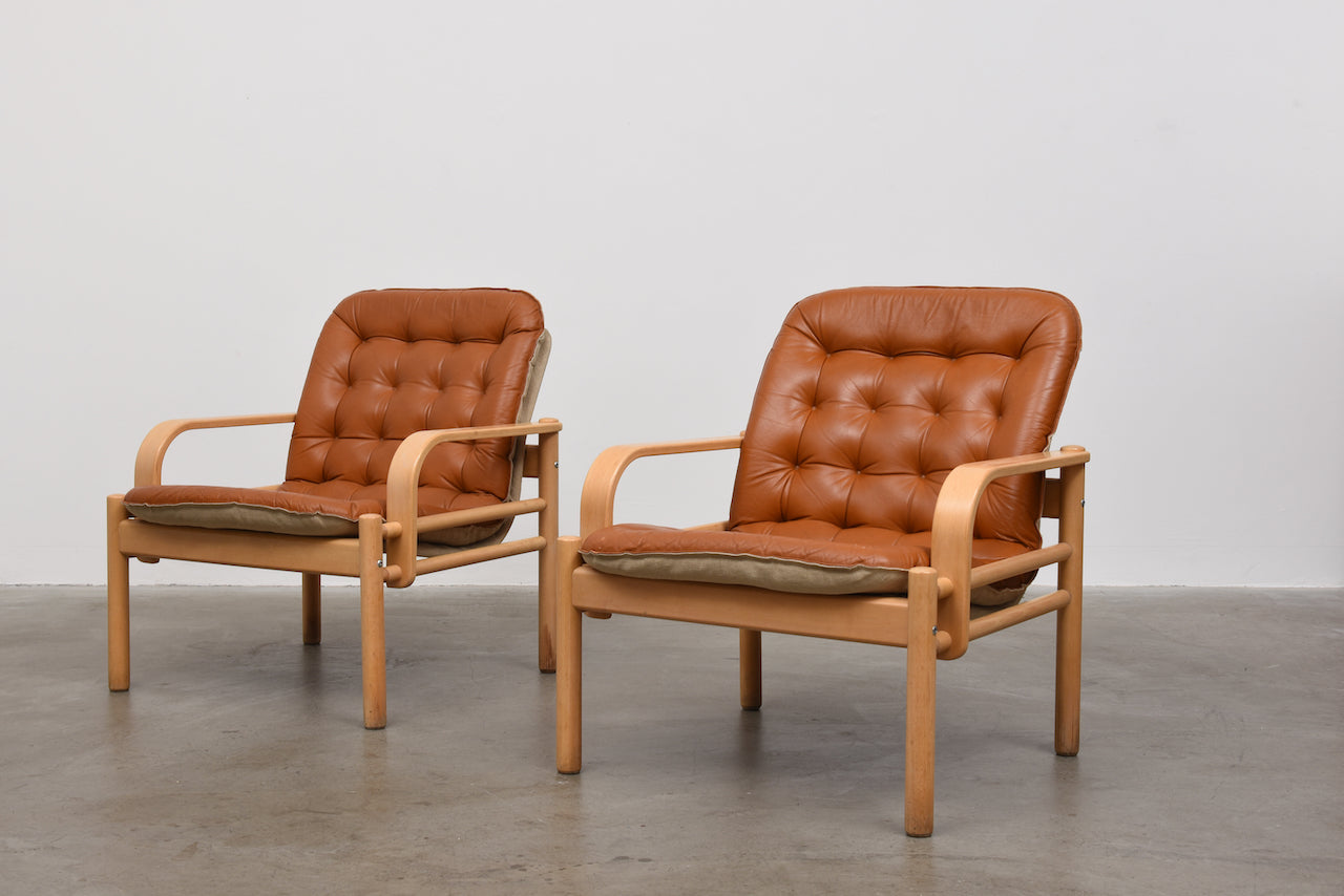 Two available: 1980s leather and beech loungers