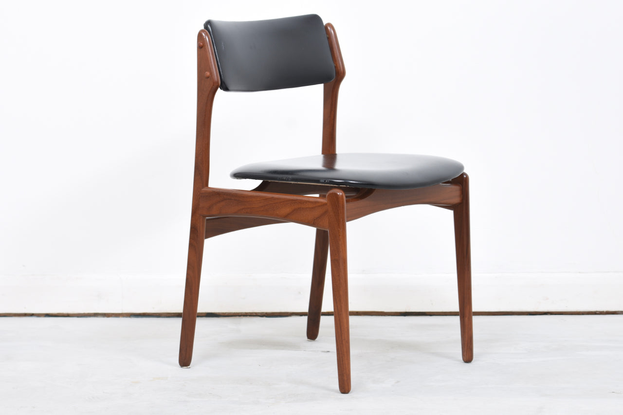 Six available: Teak + skai dining chairs