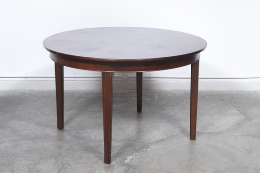 Extending dining table in rosewood