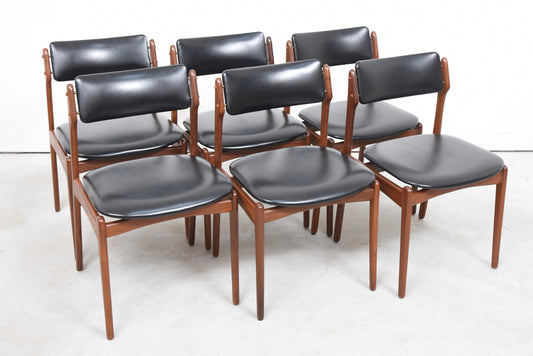 Six available: Teak + skai dining chairs