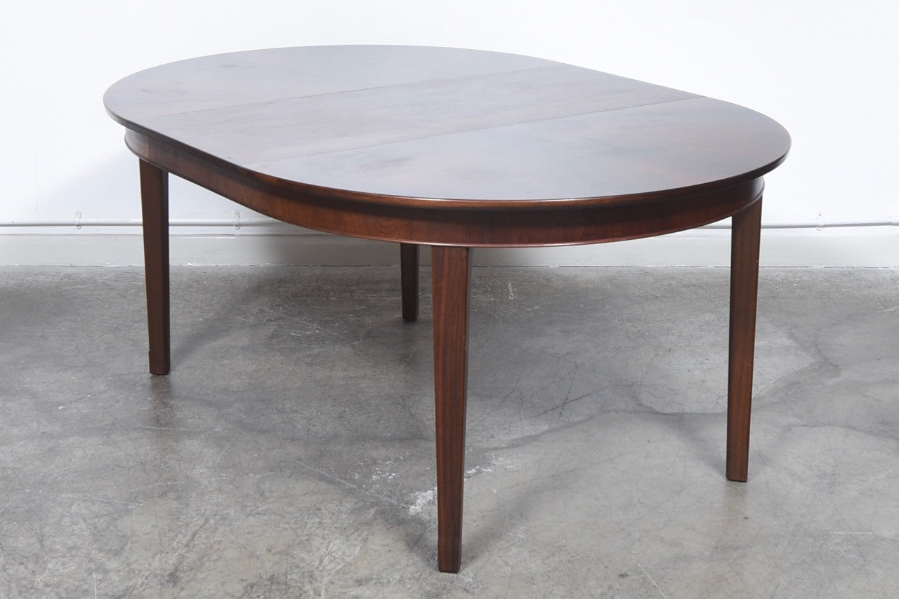 Extending dining table in rosewood