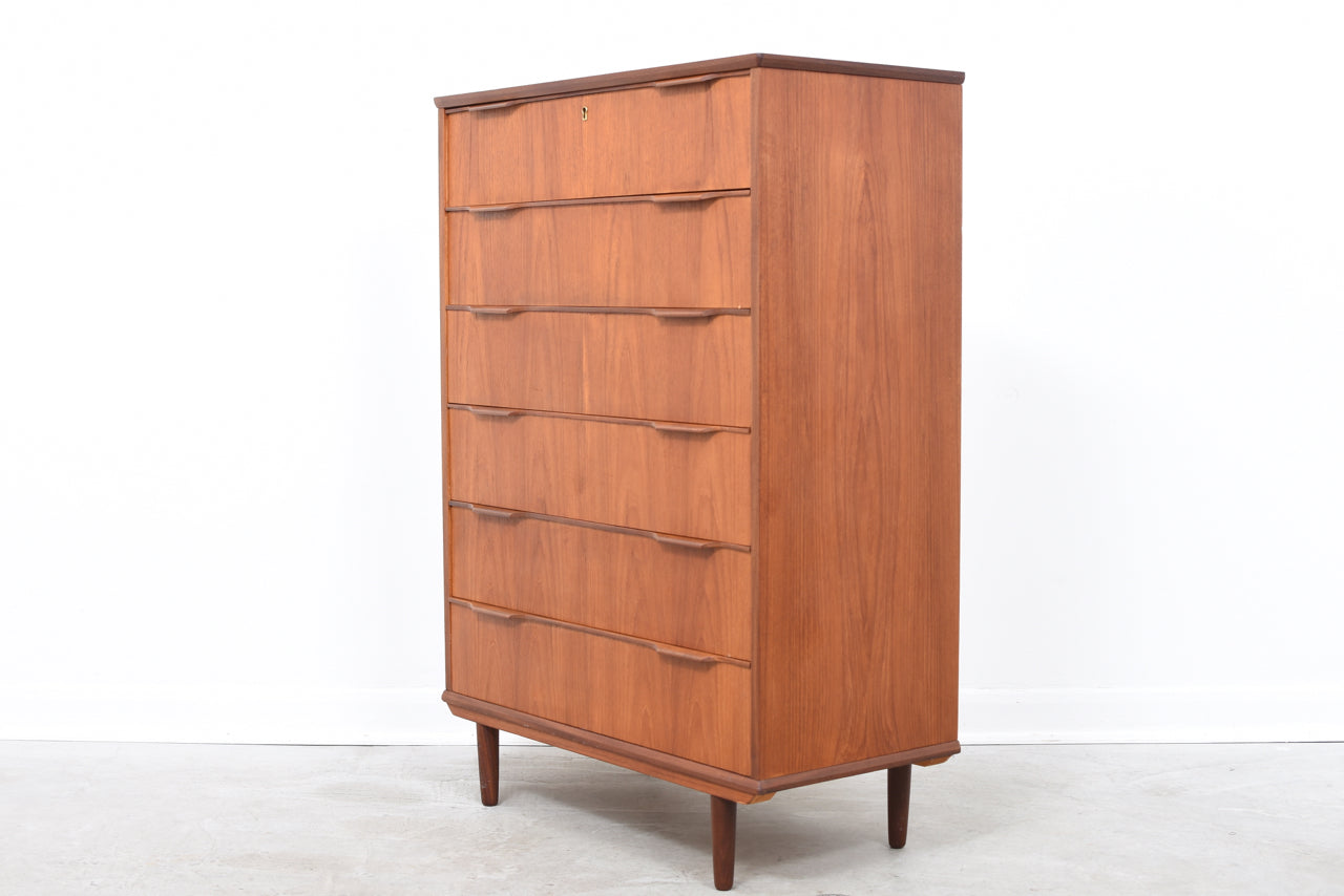 Tall teak chest of drawers