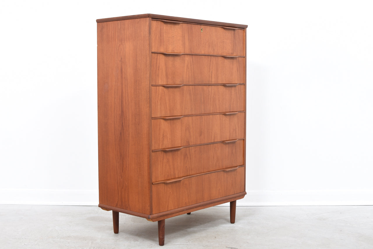 Tall teak chest of drawers