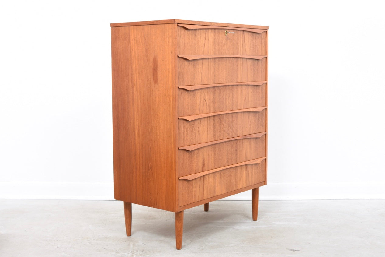 Teak chest of drawers with lipped handles