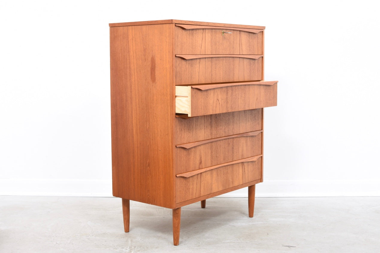 Teak chest of drawers with lipped handles