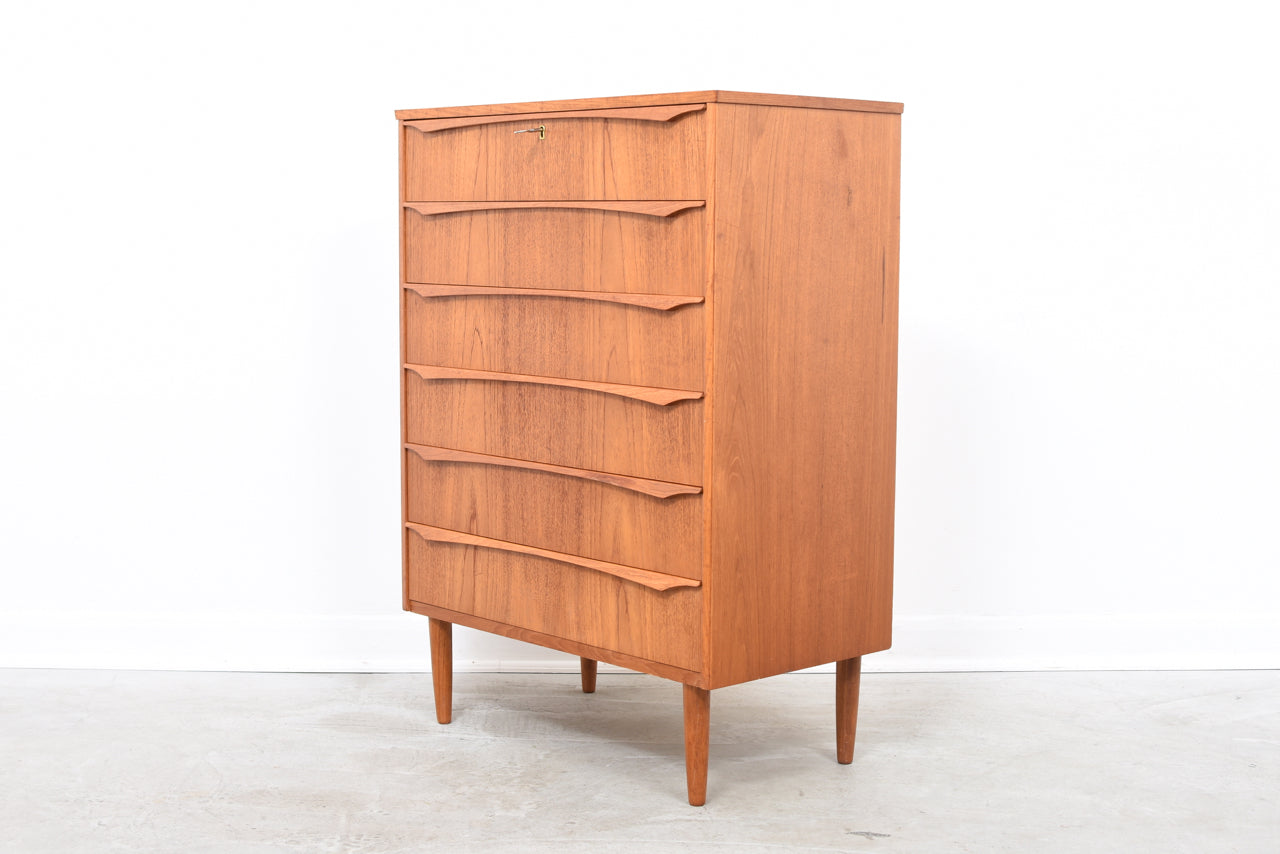 Teak chest of drawers with lipped handles