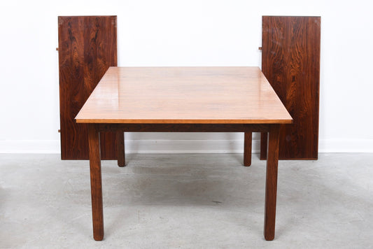Extending rosewood dining table by Erik Buch