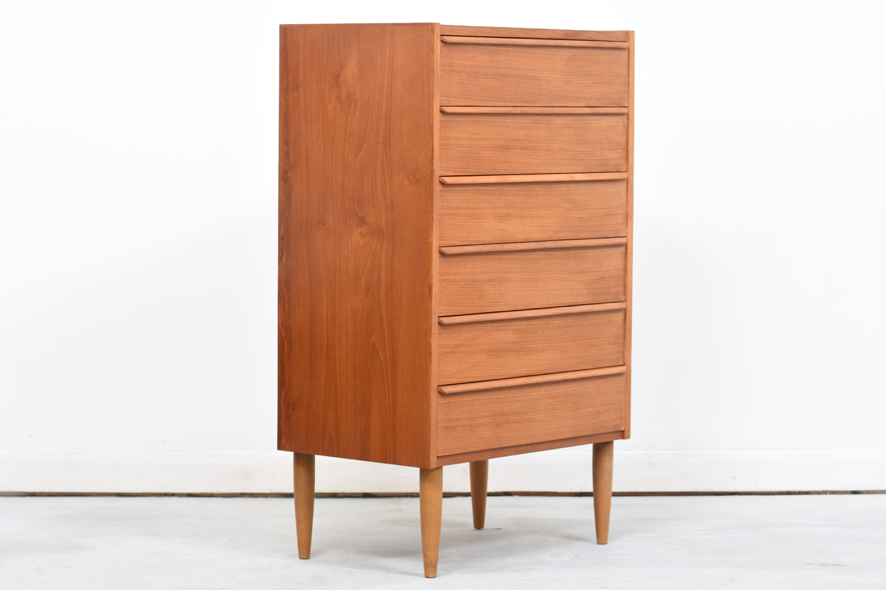 Teak chest of drawers with lipped handles