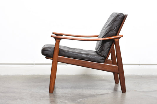 Teak lounge chair with leather cushions