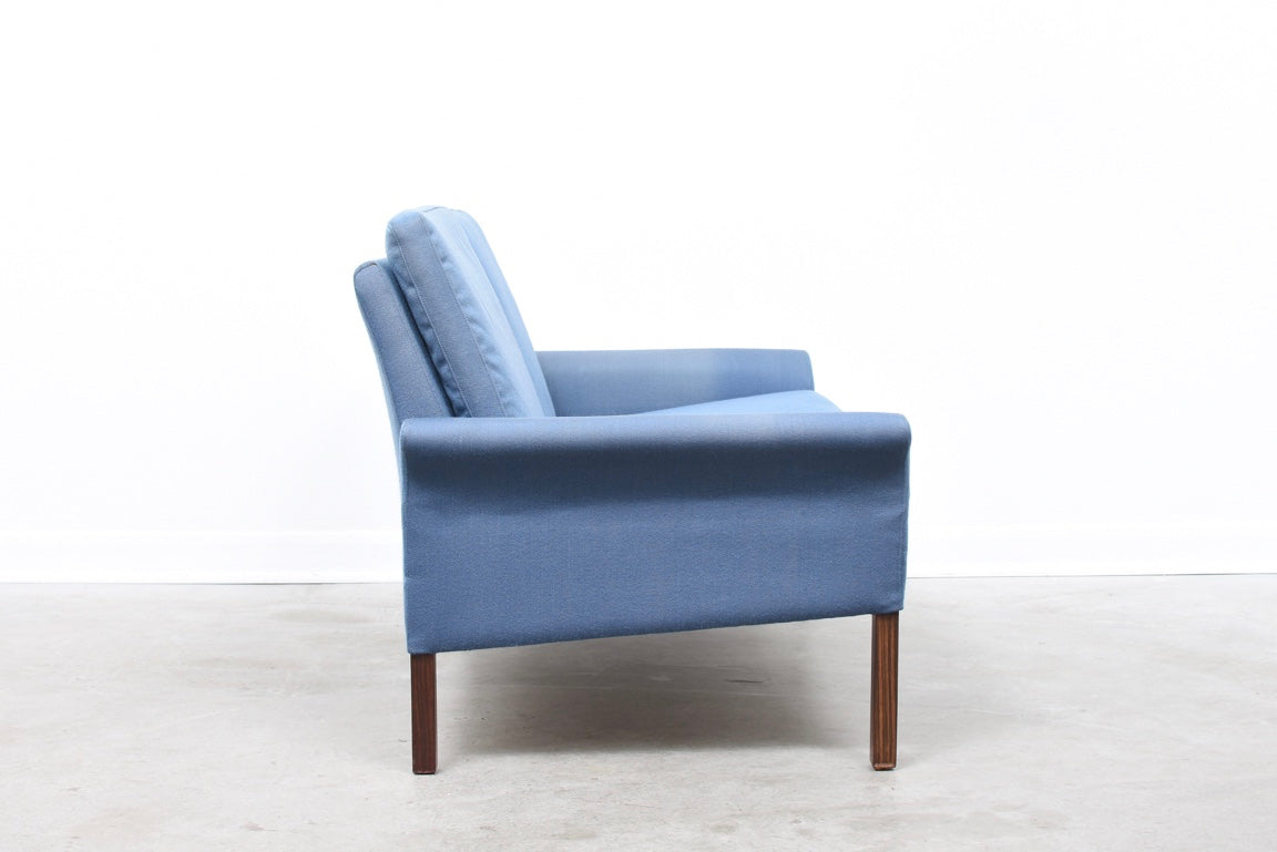 Baby blue two seater on rosewood legs