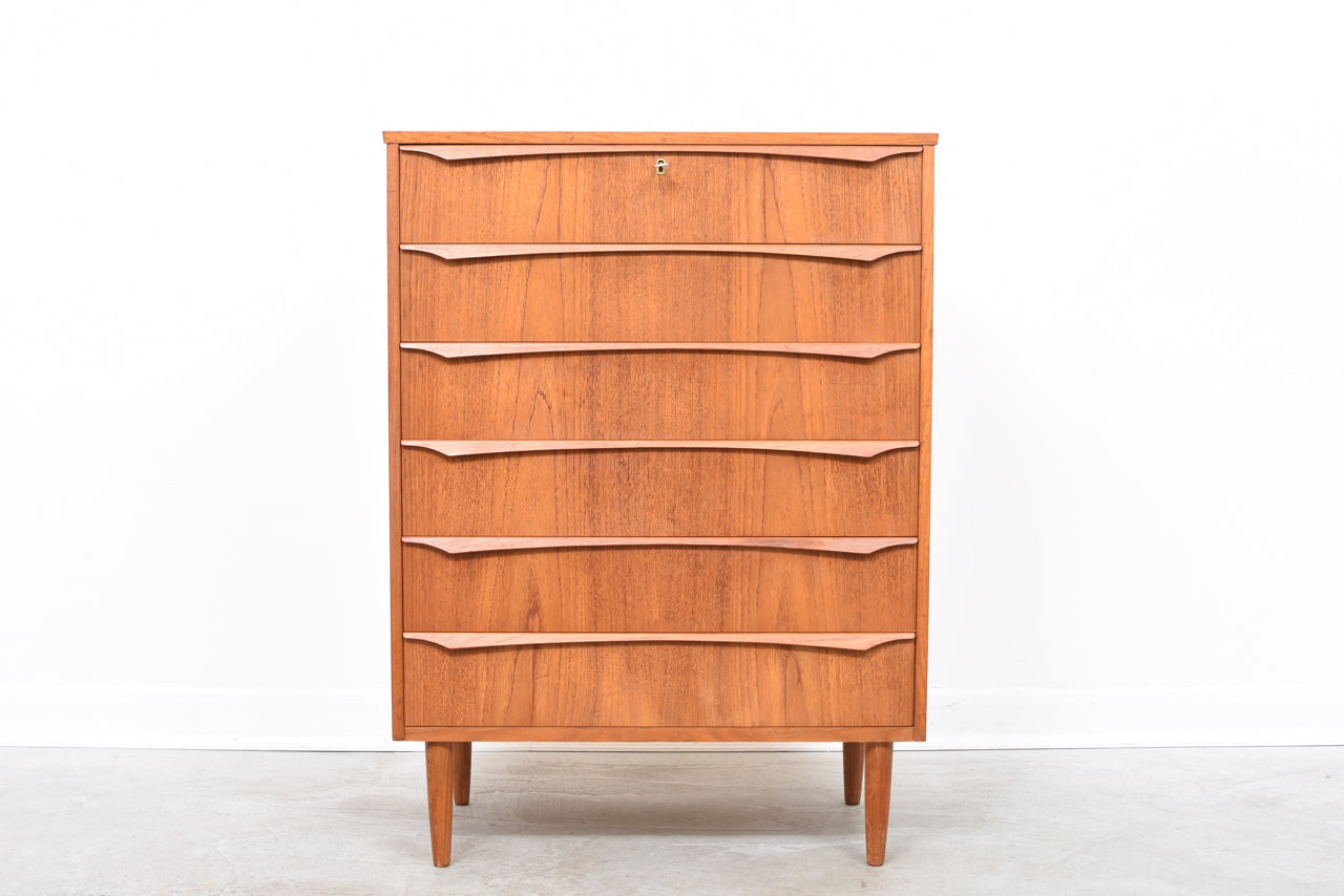 Teak chest of drawers with lipped handles