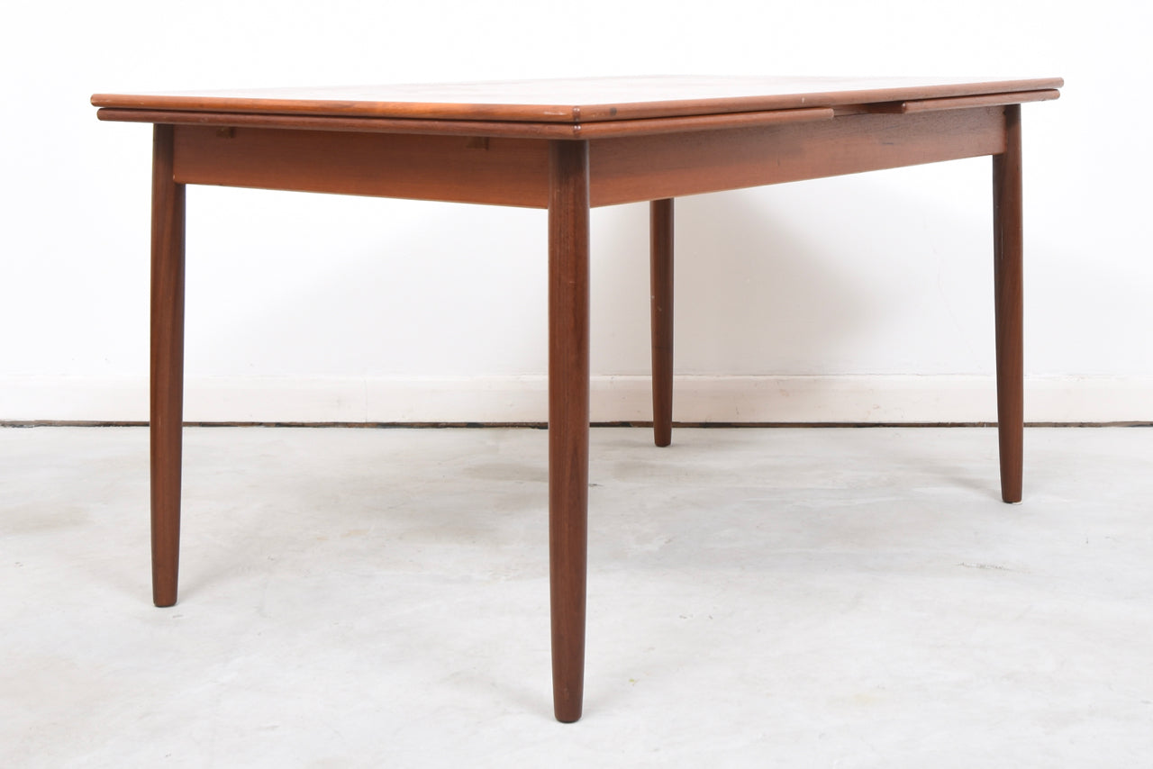 Extending rectangular dining table in teak