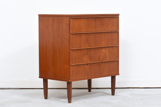Low chest of four drawers in teak